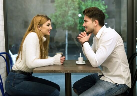 A Couple talking at a table