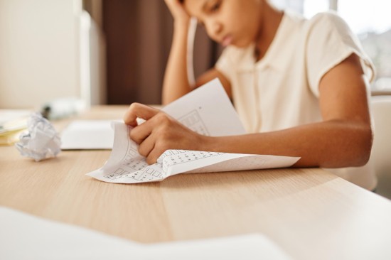 A Student crumpling paper