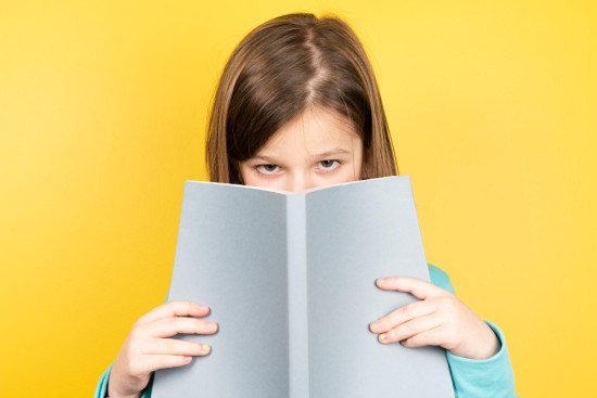 A girl holding a book