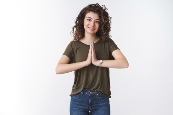 A girl posing Namastey as a token of gratitude