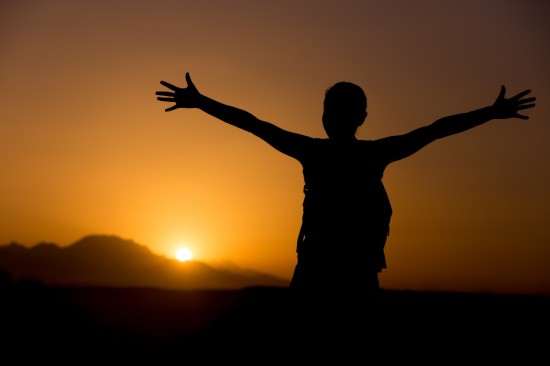 A man expressing gratitude to the nature