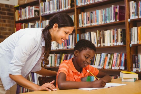 A teacher helping a student