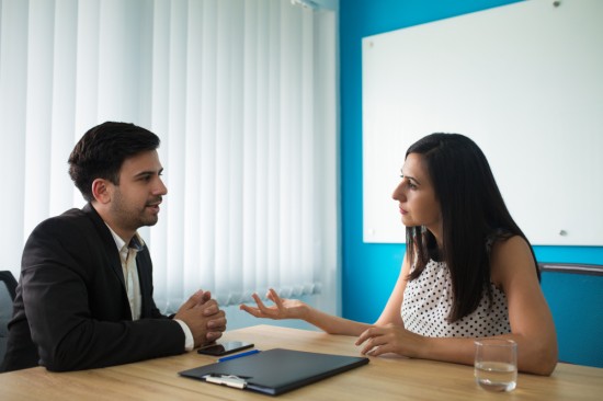 Colleague discussing with the boss