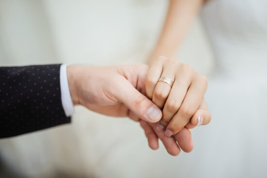 Couple holding hands together