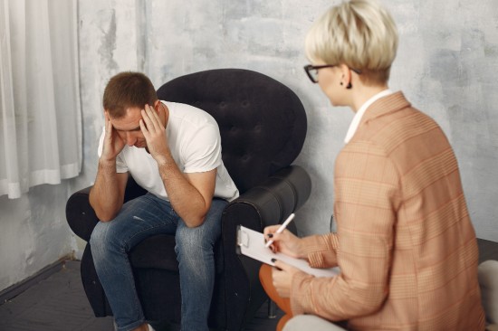 Man sitting in a Psychologist's office