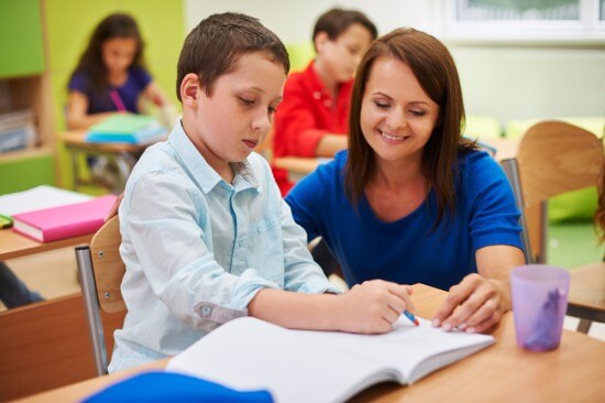 Teacher clearing the doubts of a child