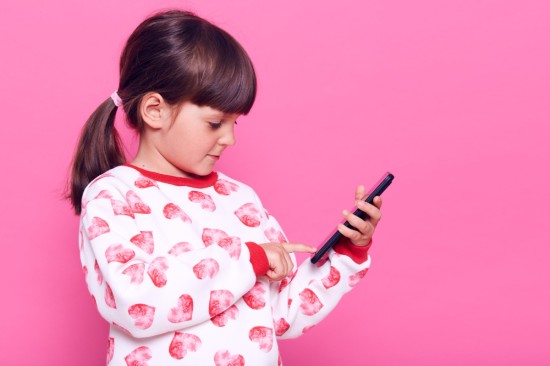 A girl holding a phone