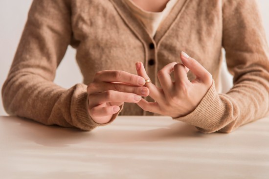 A lady pulling out the Wedding ring 