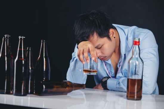 A man drinking alcohol