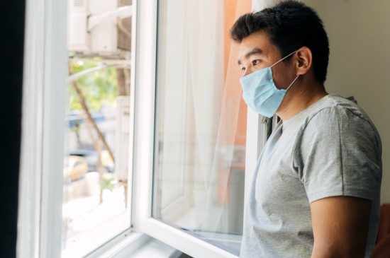 A man indoors during Covid