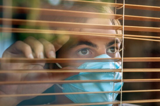 A man wearing mask being indoors