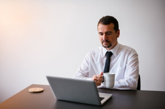 An employee working at his office desk