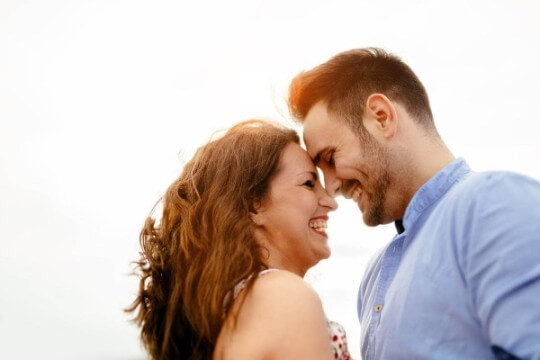 Couple laughing with love, together