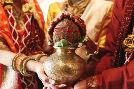 Indian husband, wife and mother-in-law at a ritual