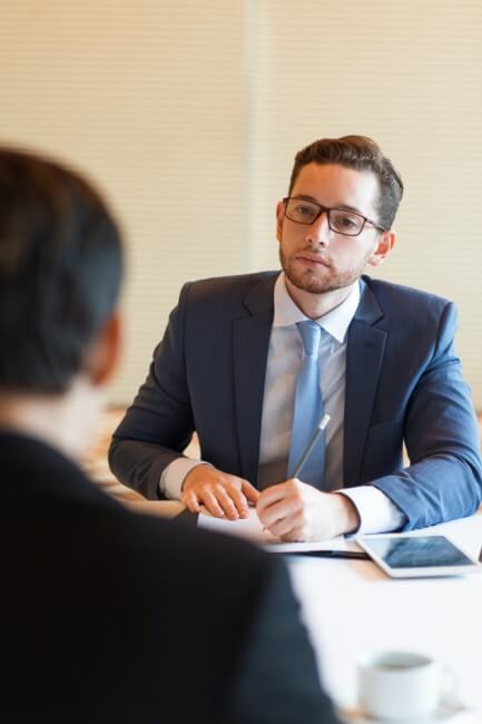 Manager conversing with an employee