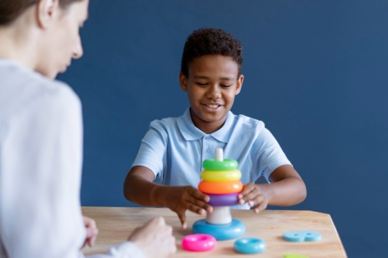 A Therapist and a child in occupational therapy session