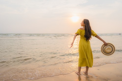 A girl enjoying herself alone at the beach