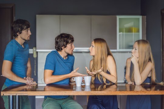 A young couple arguing at each other