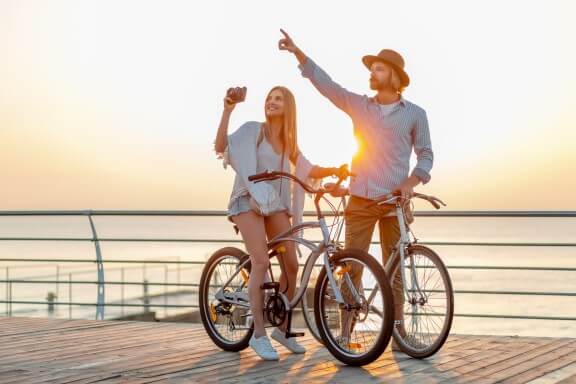 A couple is going cycling like a hobbie 
in a relationship 