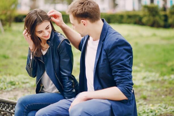 A boy flirting with a girl.