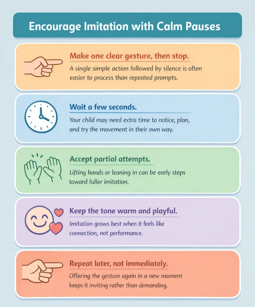 Parent pausing after clapping to encourage imitation during play